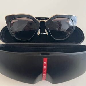 Prada Black and Gold Cat-Eye Sunglasses